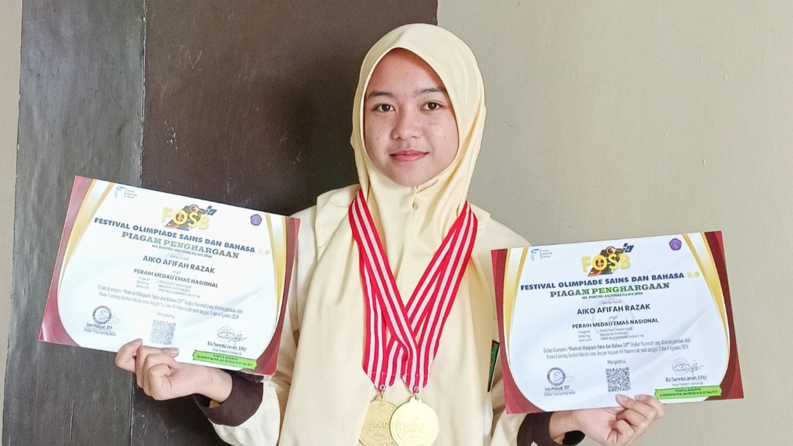 AIKO AFIFAH RAZAK PERSEMBAHKAN MEDALI EMAS UNTUK MUHI 